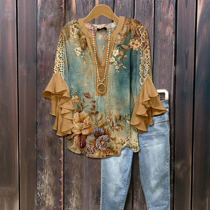 Blusa vintage con estampado floral, mangas con volantes.